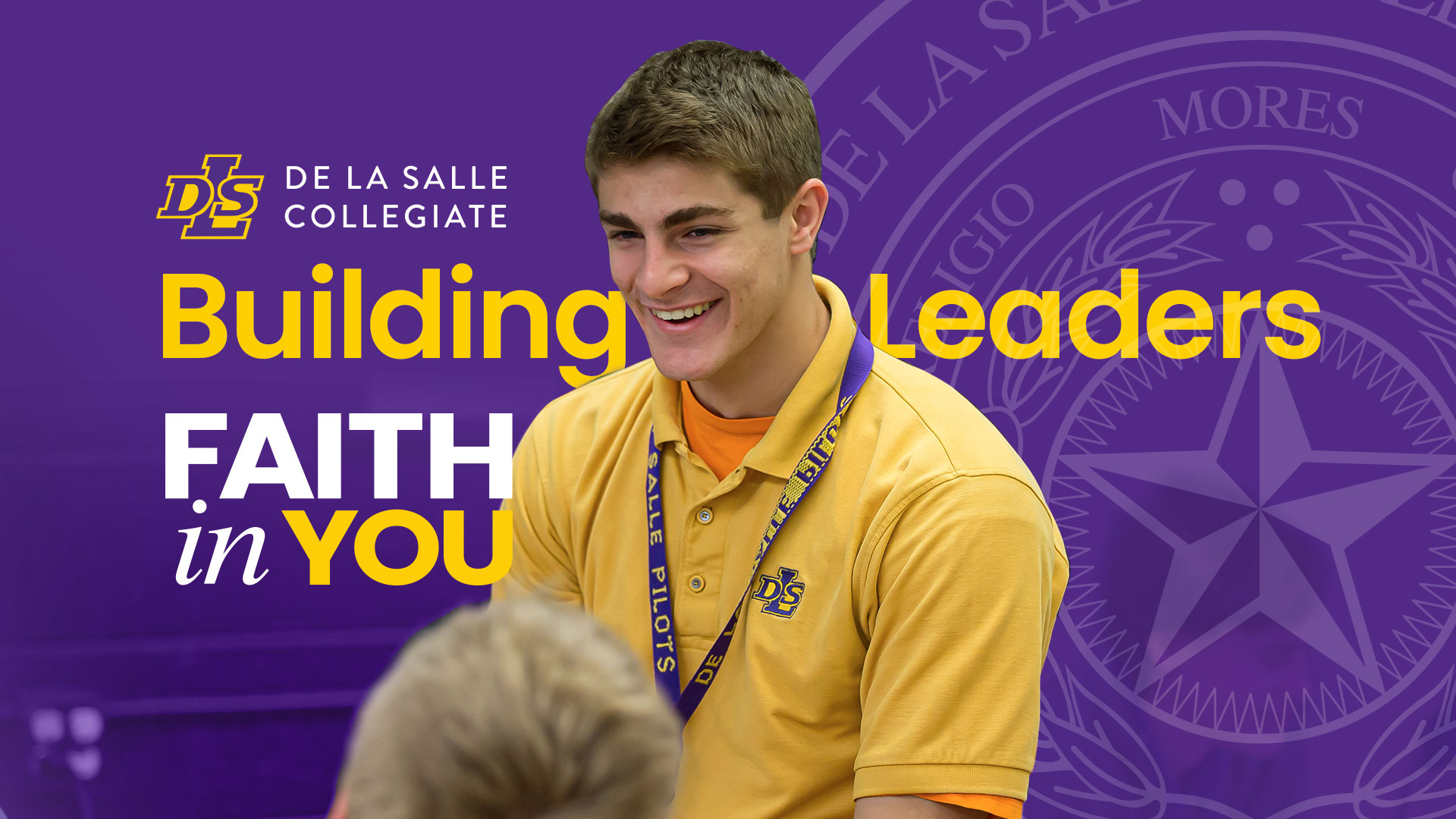 Young man in a yellow shirt smiles at another person against a purple background with De La Salle Collegiate logo and phrase "Building Leaders, Faith in You.