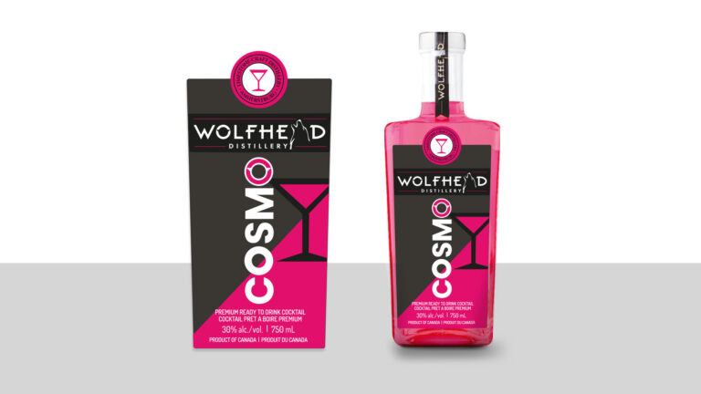 A pink bottle labeled "COSMO" from Wolfhead Distillery is shown next to its matching packaging, featuring a cocktail glass icon.