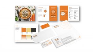 A set of branded stationery and printed guidelines featuring orange, yellow, and white color schemes for Great Lakes Pot Pie, including logo, business card, letterhead, and design standards.