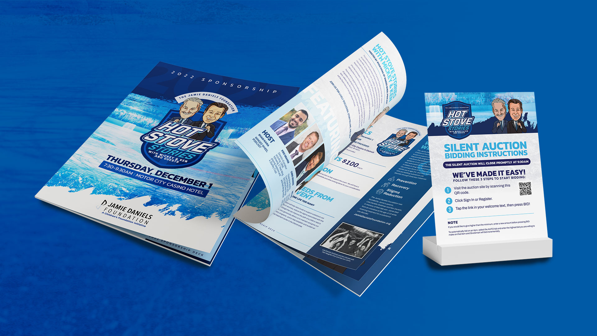 Event materials for the Jamie Daniels Foundation's Hot Stove Stories fundraiser, including a booklet, pamphlet, and silent auction bidding instructions on a blue background.